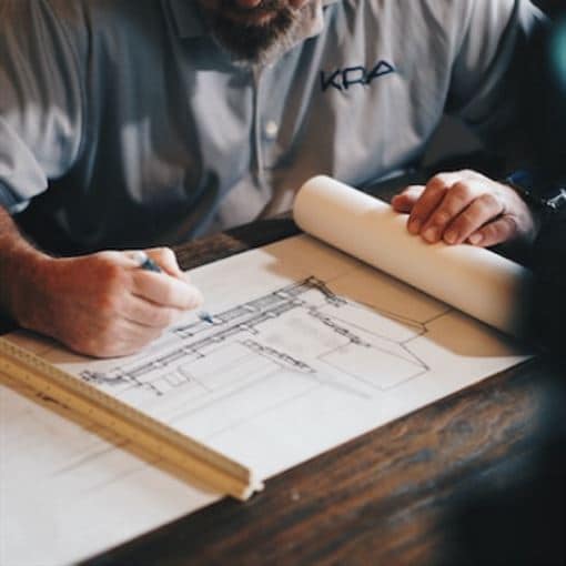 An architect drafting blueprints