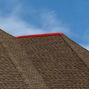 Highlighting the hip on a roof, the outward diagonal joints where two roof slopes meet.