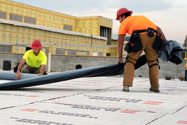 GAF certified contractors rolling out the new roof.