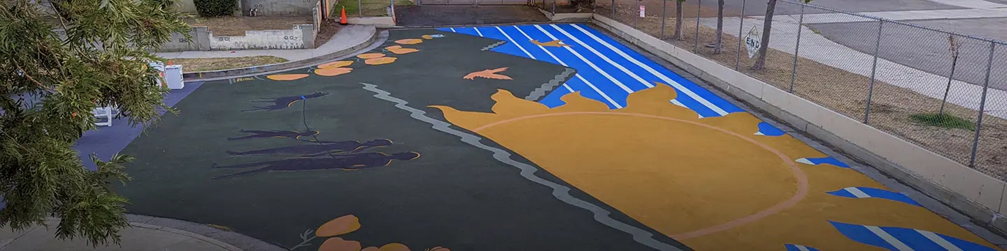 Newly designed school playground using StreetBond coating, helping cool the asphalt.