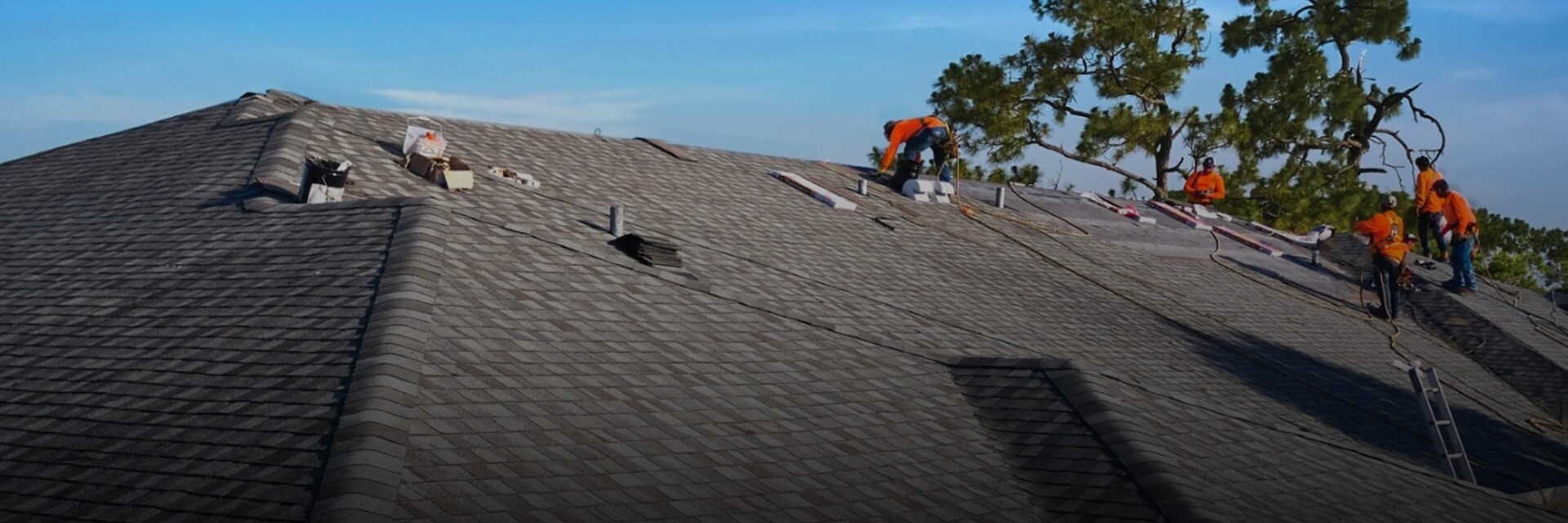 GAF certified roofers installing shingles on a roof