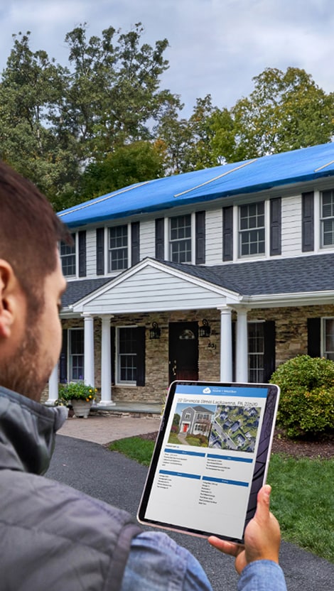 Roofing contractor using GAF ScopeConnect on a tablet