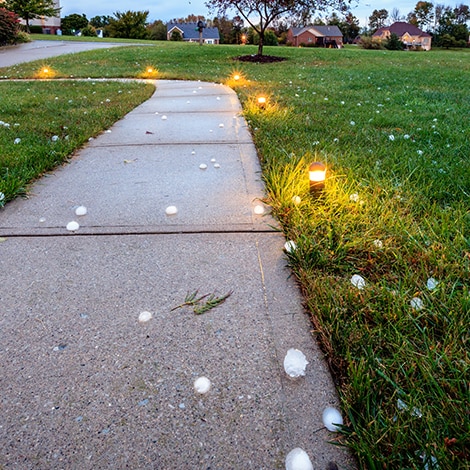 Large pieces of hail on residential sidewalk