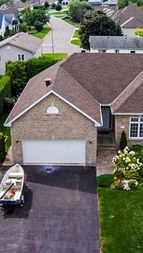 Brick home with brown Timberline UHDZ shingles