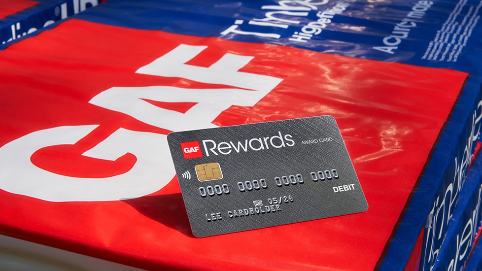 GAF rewards roofing contractor rewards card on top of packaging