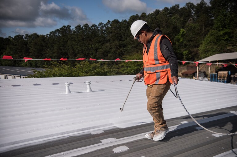 Roofers on top of commercial roof