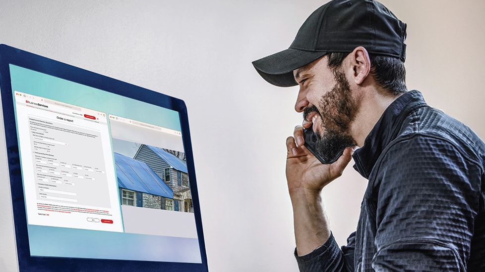 Roof contractor using GAF ScopeConnect service on computer