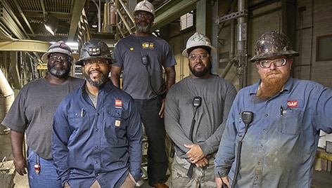 GAF employees working in American manufacturing plant